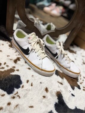 Nike Women's White Black Sneakers with Gold Accent